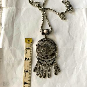 Dream catcher like silver tone necklace